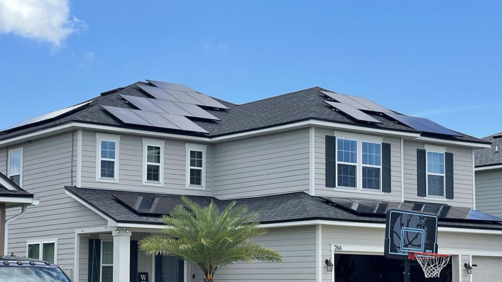 Completed roofing project under clear Florida skies